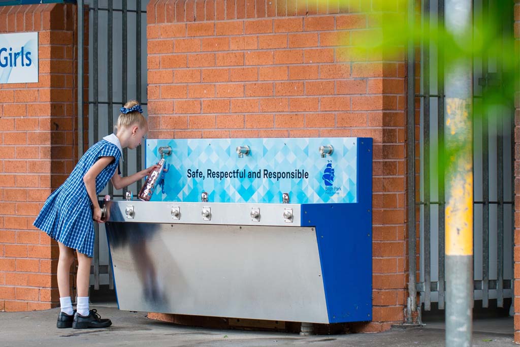 Student of Bligh Park Public School refilling her water bottle to an Aquafil Hydrobank, a Drinking Fountain and Water Bottle Refilling Station