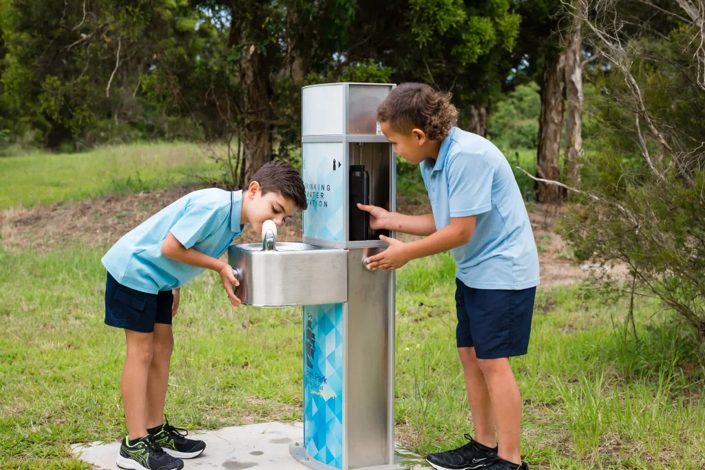 Students of Bligh Park Public School drinking and refilling their water bottle on a Civiq Aquafil Pulse Drinking Fountain