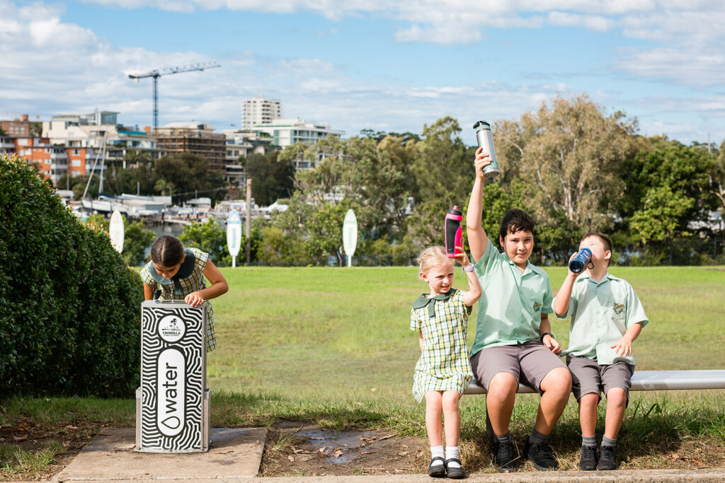 Cronulla Public School Students posting and drinking from their newly installed Aquafil Solo drinking fountain