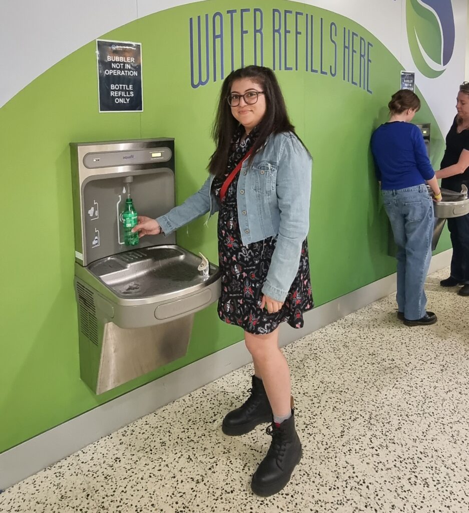 Concer goer from Qudos Bank Arena refilling her water bottle at one of the Elkay EZH2O Drinking Fountain and Water Bottle Refilling Station