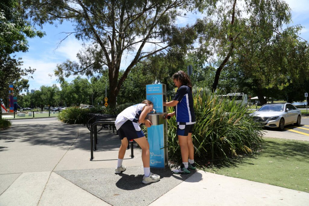 athletes drinking from an Aquafil Drinking Water Station installed at the vicinity of Melbourne Sports and Aquatic Centre