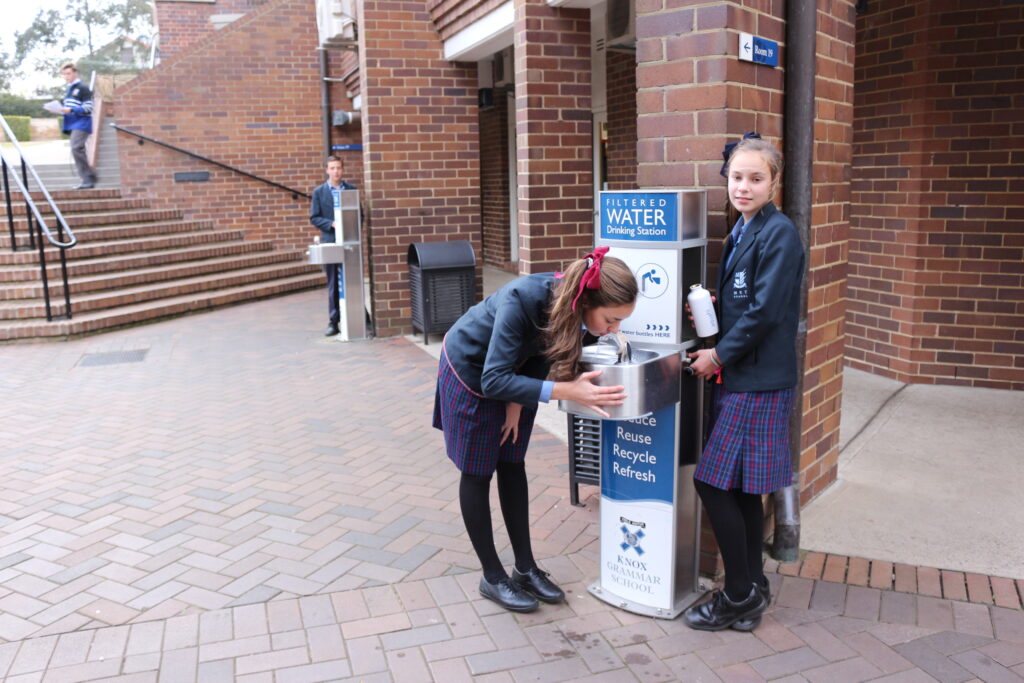 Students at Knox Grammar School drinking and refilling their water bottle at an Aquafil Drinking Water Station