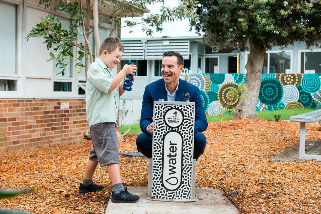 Teacher and student from Cronulla Public School responsibly refilling their water bottles at an Aquafil Solo Drinking Water Station.